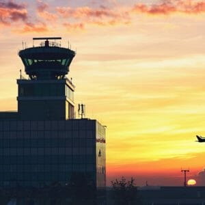 Air Traffic Control Tower at the airport during amazing sunset. Prague, Czech Republic